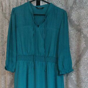 Teal ruffle dress. Long sleeve, short